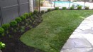 curved landscape bed, stone pavers st louis